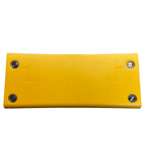 A yellow plastic object with rivets on it.